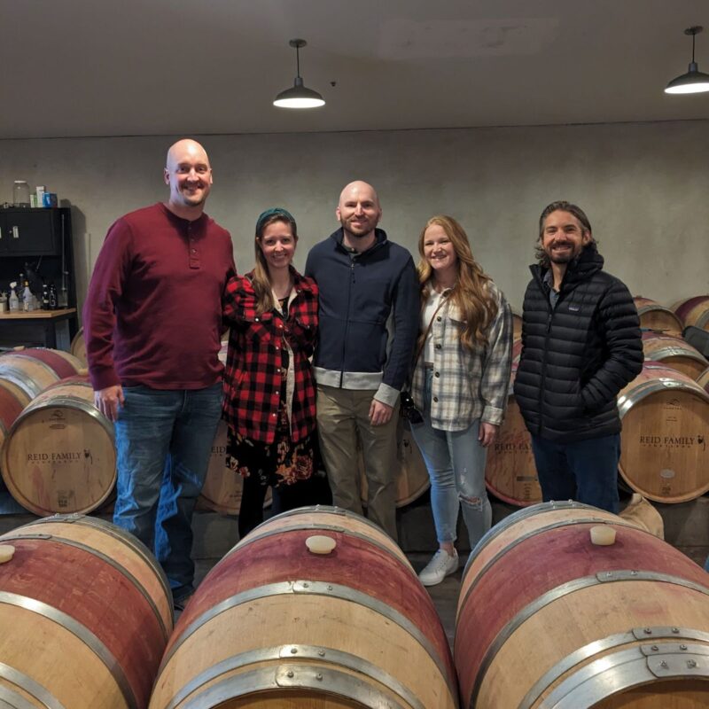 Group in barrel room at Reid Family Winery in Napa